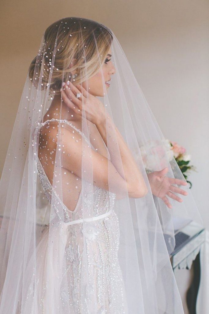 bride wearing bedazzled veil