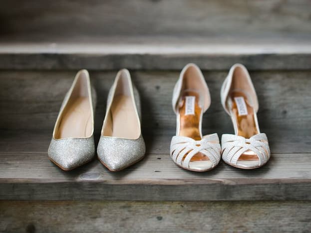 two pairs of wedding shoes 