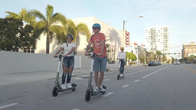 people on inokim electric scooters