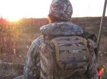 A person out in the wilderness with a quality hunting backpack on his back