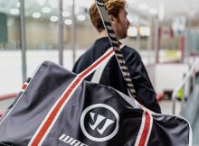 player wearing a hockey bag from Warrior