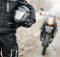 person holding a motorcycle helmet